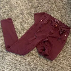 Distressed maroon jeans